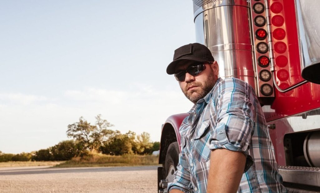 truck driver near red truck