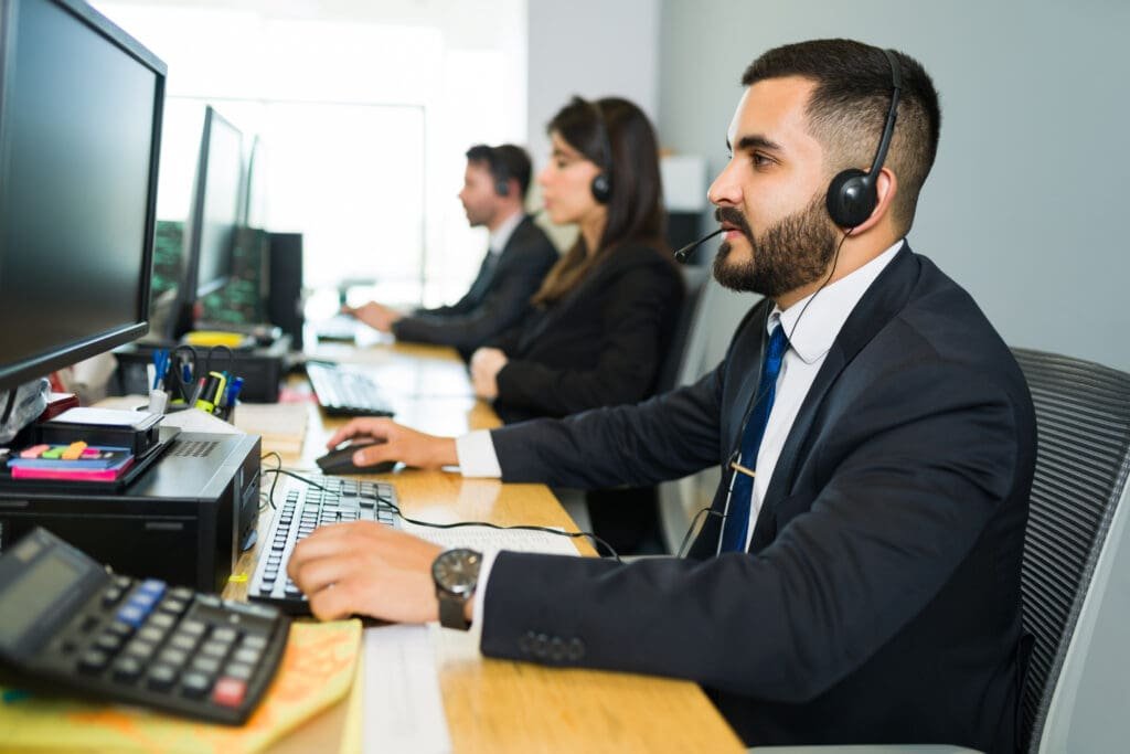 person with headphones in a call center