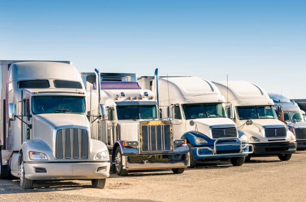 semi trucks in a parking lot
